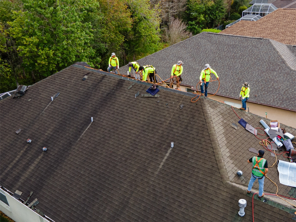 Crew in Palm Bay working on an asphalt roof